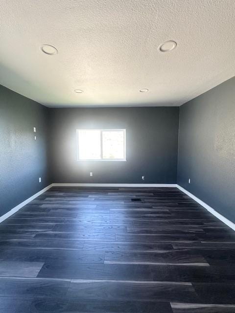 2900 S Montana St Unit 14, Butte, MT 59701 - unfurnished room featuring wood finished floors, a textured ceiling, baseboards, and recessed lighting