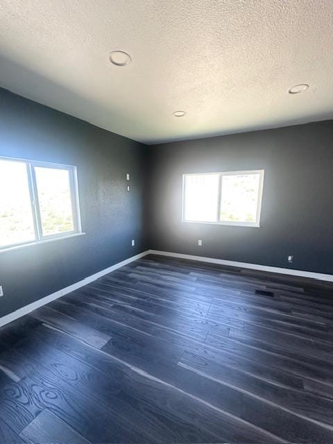 2900 S Montana St Unit 14, Butte, MT 59701 - unfurnished room featuring a textured ceiling, wood finished floors, baseboards, and recessed lighting