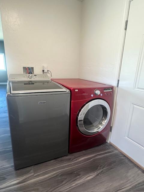 2900 S Montana St Unit 14, Butte, MT 59701 - washroom featuring washer and clothes dryer and dark wood-style flooring