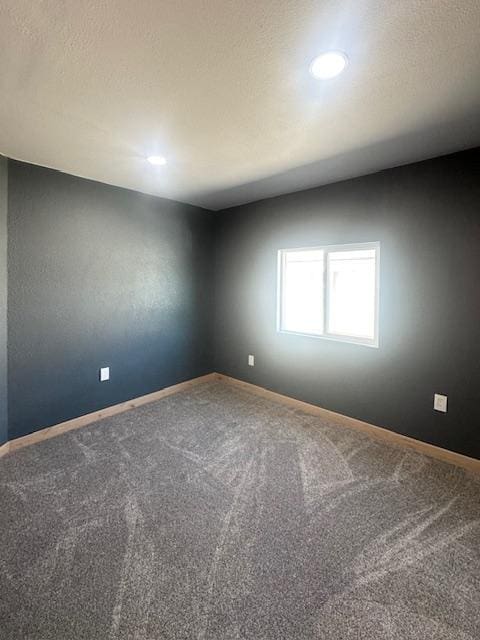 2900 S Montana St Unit 14, Butte, MT 59701 - carpeted spare room featuring baseboards, recessed lighting, and a textured ceiling