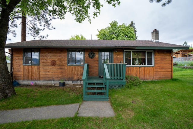 521 Clay St, Thompson Falls, MT 59873 - view of front facade with a front yard, a chimney, and roof with shingles