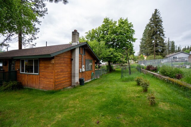 521 Clay St, Thompson Falls, MT 59873 - view of side of property featuring a chimney and roof with shingles