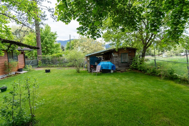 521 Clay St, Thompson Falls, MT 59873 - view of yard with a mountain view and an outbuilding