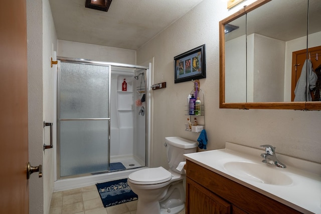 521 Clay St, Thompson Falls, MT 59873 - full bathroom featuring a stall shower, vanity, tile patterned floors, and toilet