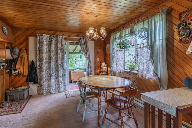 521 Clay St, Thompson Falls, MT 59873 - dining room featuring wood walls, a chandelier, and carpet flooring