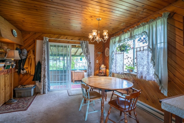 521 Clay St, Thompson Falls, MT 59873 - carpeted dining area with a chandelier and wood walls