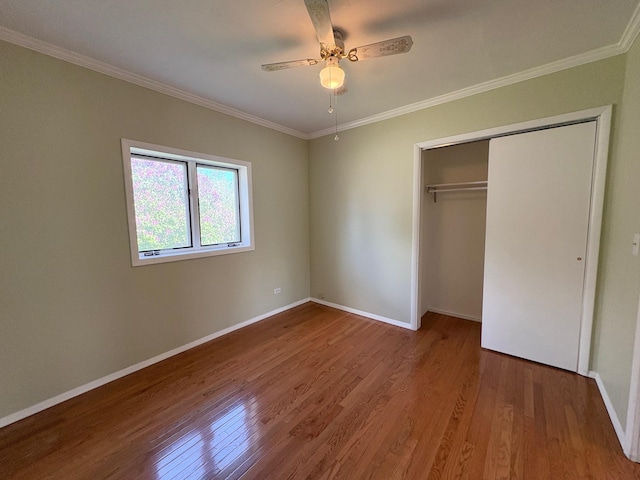 330 N Walnut St, Dillon, MT 59725 - unfurnished bedroom with wood finished floors, crown molding, baseboards, a closet, and ceiling fan