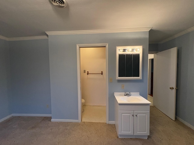 330 N Walnut St, Dillon, MT 59725 - bathroom featuring crown molding, vanity, toilet, and baseboards