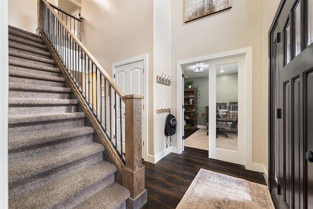322 Hemlock St, Anaconda, MT 59711 - entryway featuring a towering ceiling, dark wood finished floors, stairway, and baseboards