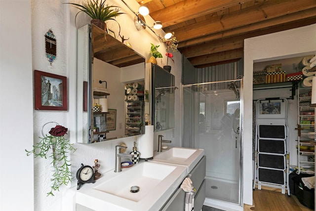 2879 Soft Rock Rd, Corvallis, MT 59828 - bathroom featuring a shower stall, wood ceiling with exposed beams, vanity, and wood finished floors