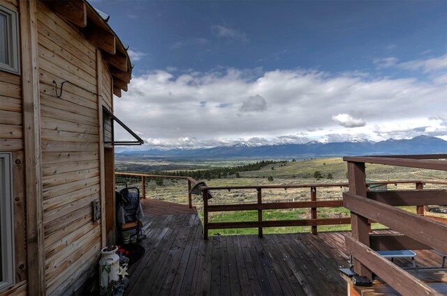 2879 Soft Rock Rd, Corvallis, MT 59828 - wooden terrace featuring a mountain view and a view of countryside