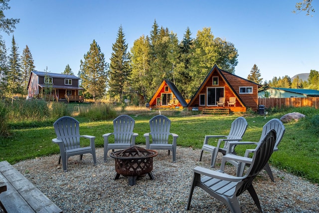 155 Seville Ln, Coram, MT 59913 - view of patio / terrace with a fire pit