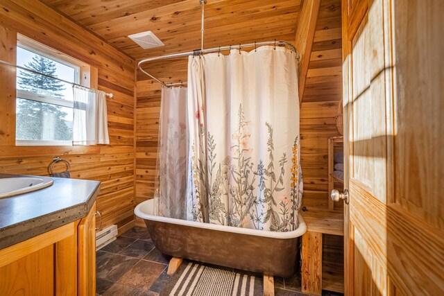 155 Seville Ln, Coram, MT 59913 - full bath with a freestanding tub, wooden walls, vanity, curtained shower, and wooden ceiling