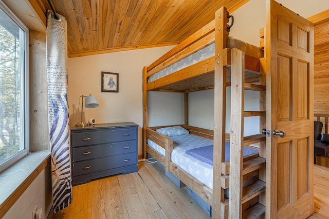155 Seville Ln, Coram, MT 59913 - bedroom featuring light wood finished floors, multiple windows, wood ceiling, and a sauna / steam room