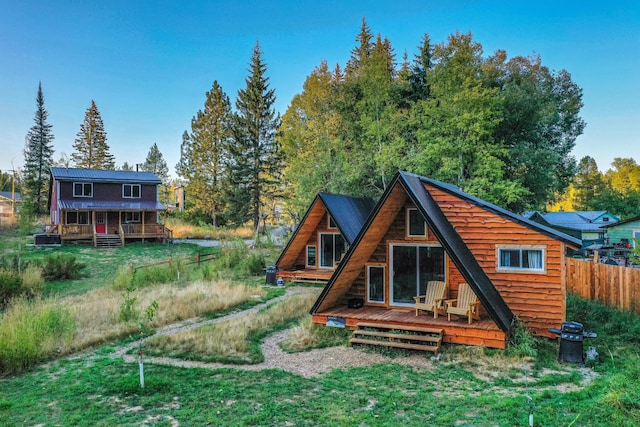 155 Seville Ln, Coram, MT 59913 - back of house with a wooden deck