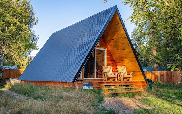 155 Seville Ln, Coram, MT 59913 - rear view of house featuring metal roof