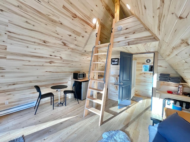 155 Seville Ln, Coram, MT 59913 - interior space featuring wooden walls, lofted ceiling, wood-type flooring, and wooden ceiling