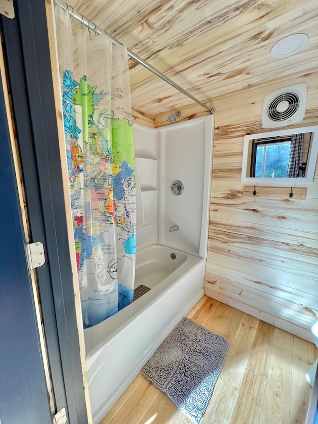 155 Seville Ln, Coram, MT 59913 - bathroom with wooden ceiling, shower / bath combination with curtain, and wood finished floors