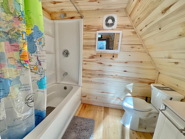 155 Seville Ln, Coram, MT 59913 - full bath with wooden walls, wood finished floors, wood ceiling, toilet, and shower / bath combo with shower curtain