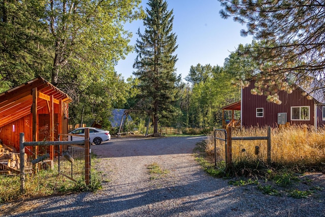 155 Seville Ln, Coram, MT 59913 - view of dirt / gravel driveway featuring a gated entry