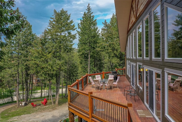 277 Ridge Loop Rd, Rexford, MT 59930 - wooden deck with outdoor dining area and area for grilling