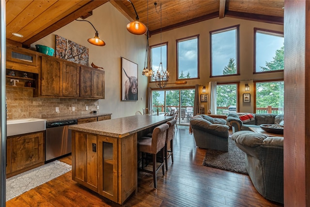 277 Ridge Loop Rd, Rexford, MT 59930 - kitchen with dishwasher, wood ceiling with exposed beams, dark wood-type flooring, open floor plan, and a kitchen bar