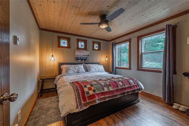 277 Ridge Loop Rd, Rexford, MT 59930 - bedroom with crown molding, wood finished floors, baseboards, wood ceiling, and a ceiling fan