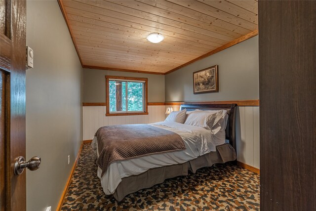 277 Ridge Loop Rd, Rexford, MT 59930 - bedroom featuring crown molding, wainscoting, and wood ceiling