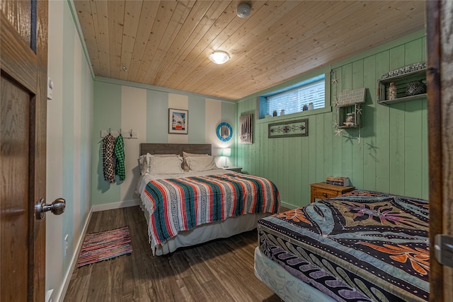 277 Ridge Loop Rd, Rexford, MT 59930 - bedroom featuring baseboards, wood finished floors, wooden ceiling, and wooden walls
