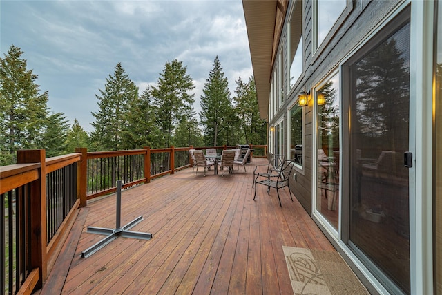 277 Ridge Loop Rd, Rexford, MT 59930 - deck featuring outdoor dining space and view of scattered trees
