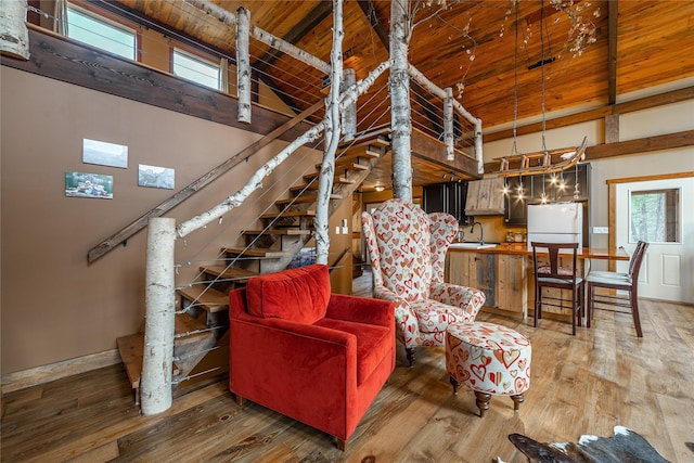 277 Ridge Loop Rd, Rexford, MT 59930 - living area with wooden ceiling, light wood-type flooring, stairs, and lofted ceiling