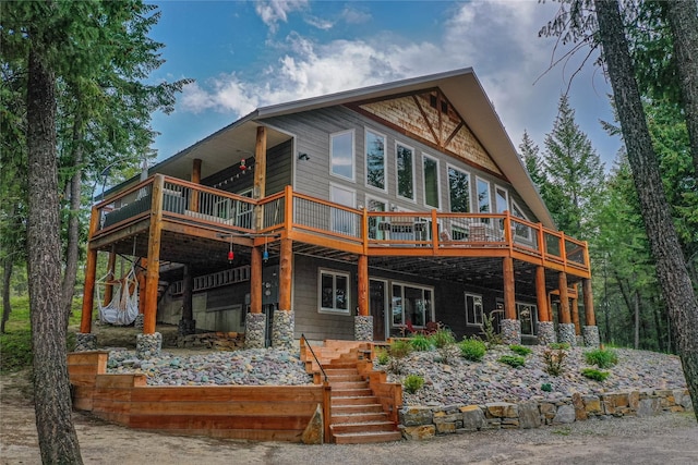 277 Ridge Loop Rd, Rexford, MT 59930 - rear view of house featuring stairway and a wooden deck