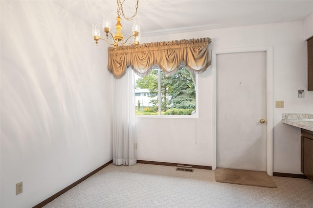640 W Crestline Dr, Missoula, MT 59803 - unfurnished dining area featuring a chandelier, light carpet, and baseboards
