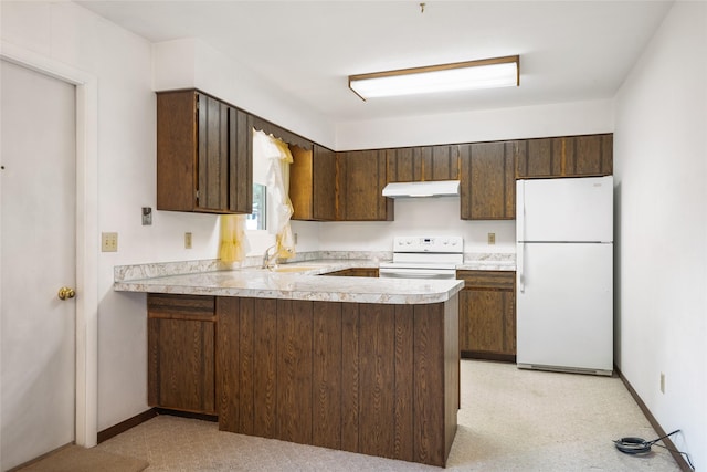 640 W Crestline Dr, Missoula, MT 59803 - kitchen featuring white appliances, under cabinet range hood, a sink, dark brown cabinets, and light countertops