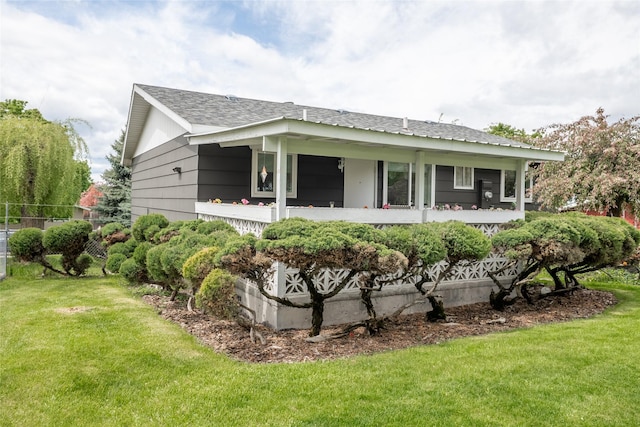 640 W Crestline Dr, Missoula, MT 59803 - rear view of house with a yard, a porch, and a shingled roof