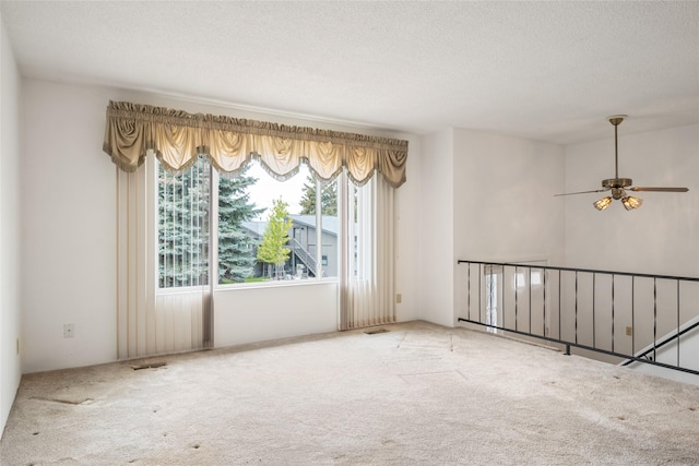 640 W Crestline Dr, Missoula, MT 59803 - empty room with carpet, ceiling fan, and a textured ceiling