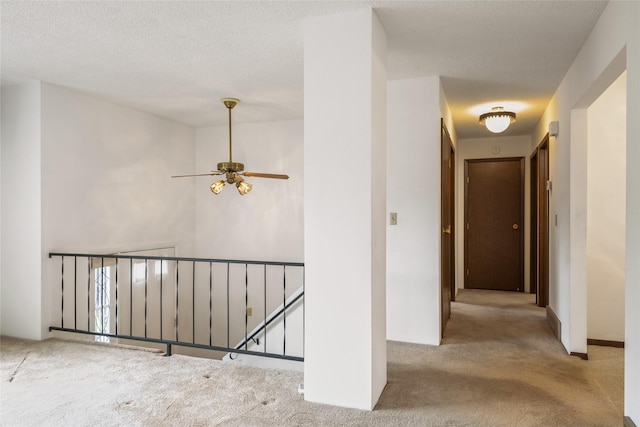 640 W Crestline Dr, Missoula, MT 59803 - corridor with an upstairs landing, carpet floors, and a textured ceiling