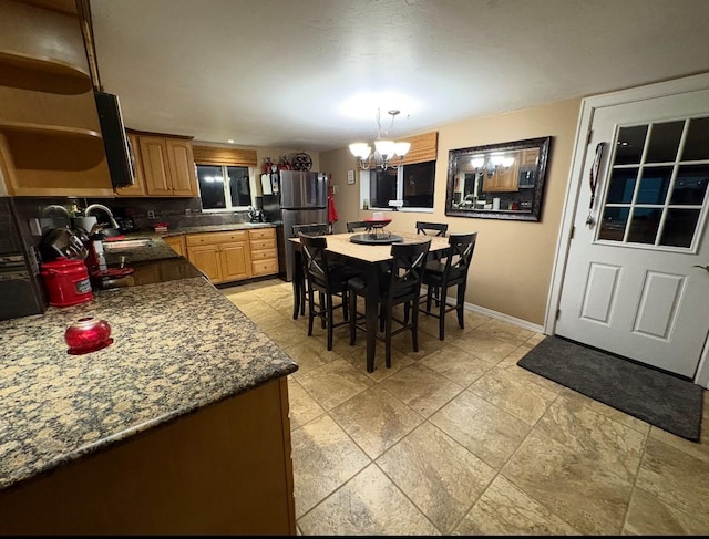 614 Johnson Ln, Superior, MT 59872 - dining space with a chandelier and baseboards