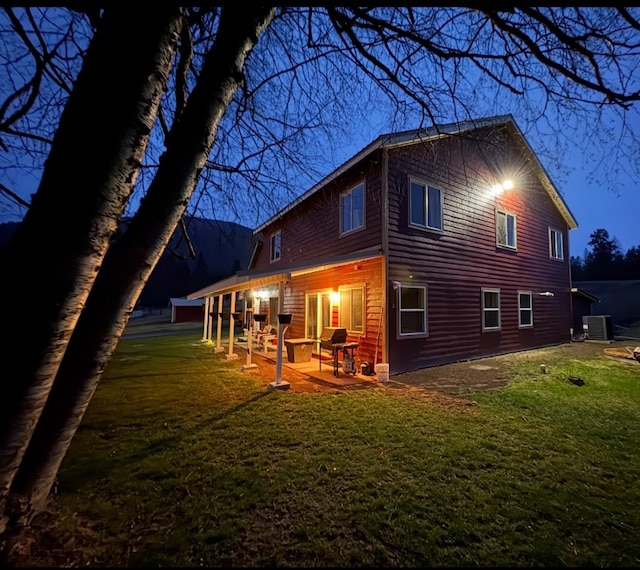 614 Johnson Ln, Superior, MT 59872 - back of house featuring cooling unit, a patio area, and a yard