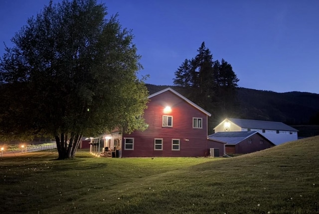 614 Johnson Ln, Superior, MT 59872 - view of home's exterior featuring a yard and central AC