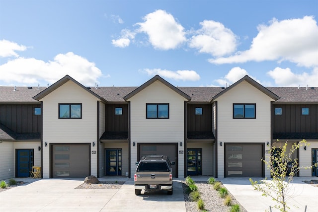 4394 Brookside Ln, Bozeman, MT 59718 - townhome / multi-family property featuring board and batten siding, driveway, an attached garage, and a shingled roof