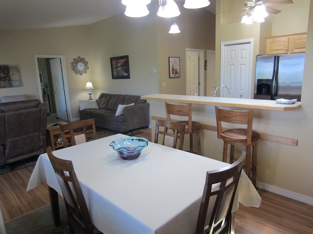 2220 Alpine Dr, Helena, MT 59601 - dining area featuring dark wood finished floors, baseboards, lofted ceiling, and ceiling fan