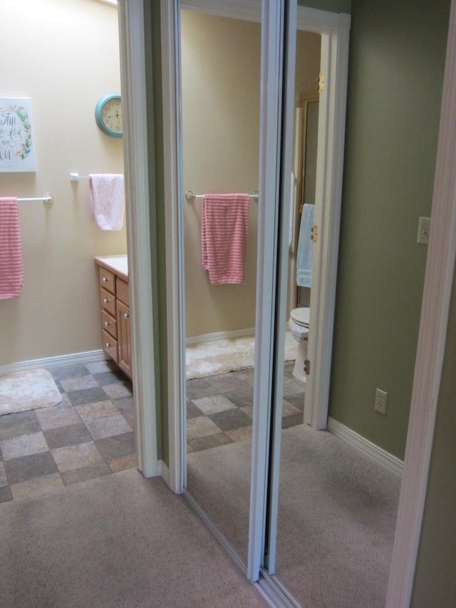 2220 Alpine Dr, Helena, MT 59601 - bathroom featuring vanity, toilet, and baseboards