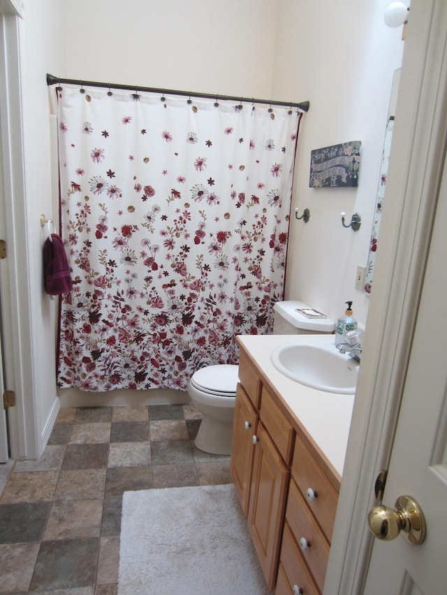 2220 Alpine Dr, Helena, MT 59601 - bathroom featuring vanity, toilet, and a shower with shower curtain