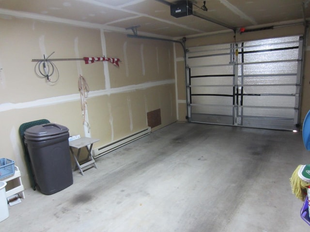 2220 Alpine Dr, Helena, MT 59601 - garage featuring a baseboard heating unit and a garage door opener