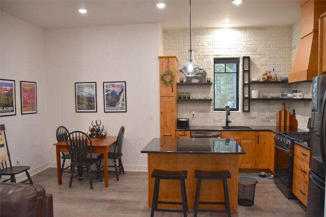 101 Little Mountain Rd, Whitefish, MT 59937 - kitchen with black appliances, open shelves, dark countertops, backsplash, and wood finished floors