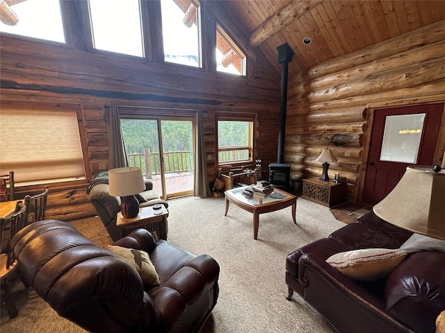 3966 Main Boulder Rd, Big Timber, MT 59011 - carpeted living area featuring a wood stove, wood ceiling with exposed beams, rustic walls, and high vaulted ceiling