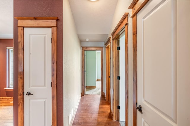 10 Canyon Breeze Ct, Stevensville, MT 59870 - corridor featuring a textured wall, wood finished floors, and baseboards