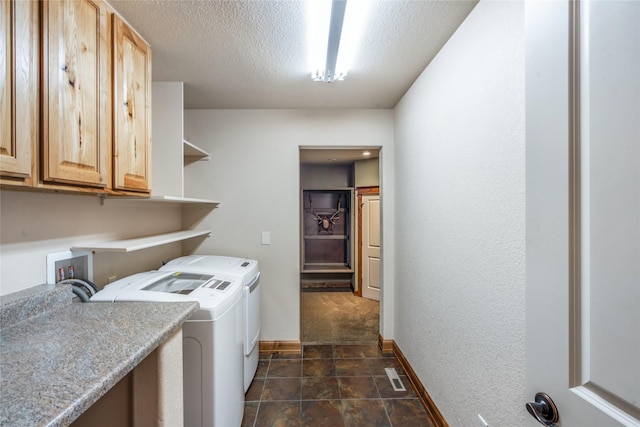 10 Canyon Breeze Ct, Stevensville, MT 59870 - laundry room with independent washer and dryer, cabinet space, a textured ceiling, and baseboards