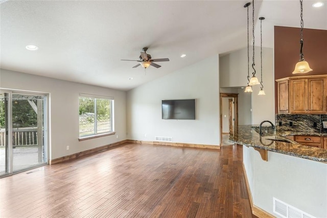 10 Canyon Breeze Ct, Stevensville, MT 59870 - unfurnished living room with dark wood-style flooring, ceiling fan, a sink, recessed lighting, and baseboards
